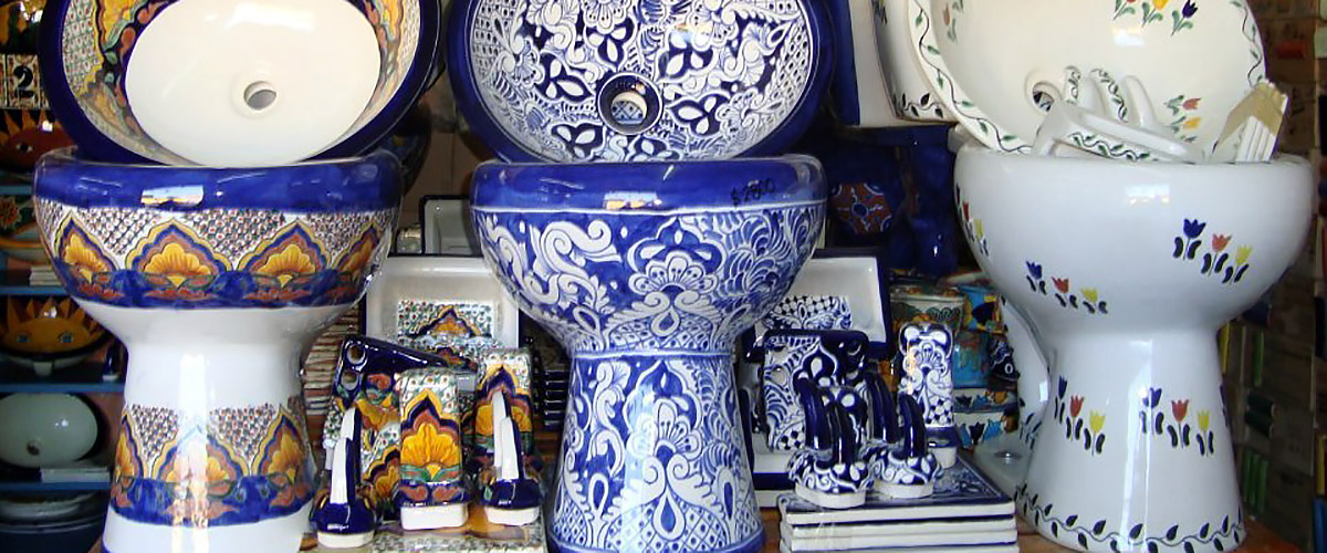 hand painted toilet installed in a bathroom